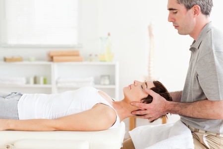 Man stretching a cute woman in a roomの写真素材