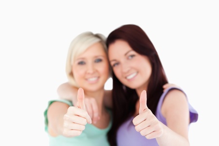 Cute friends posing in a studioの写真素材