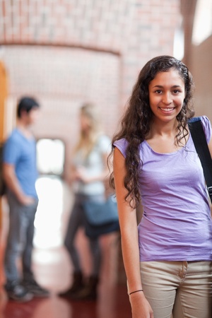 Portrait of a young student posing in a corridorの写真素材