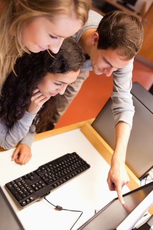 Portrait of a fellow students using a computer in an IT room
