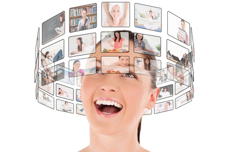 Pretty woman posing while standing against a white backgroundの写真素材