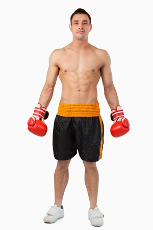 Young boxer looking confident against a white backgroundの写真素材