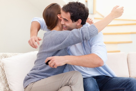 Couple getting engaged in their living room