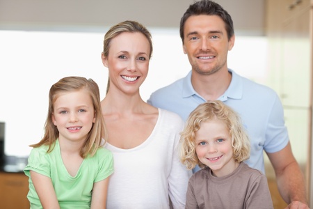 Cheerful family together in the kitchenの写真素材