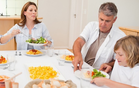 Family about to start dinner togetherの写真素材
