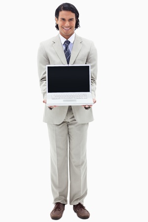 Portrait of a smiling businessman showing a notebook against a white backgroundの写真素材