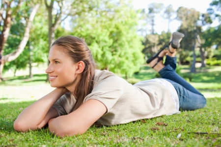 Young woman taking a moment off in the parkの写真素材