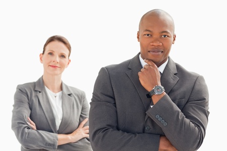 A businessman and woman are posingの写真素材