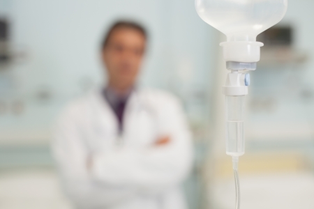 Phial in front of doctor in hospital bedroomの写真素材