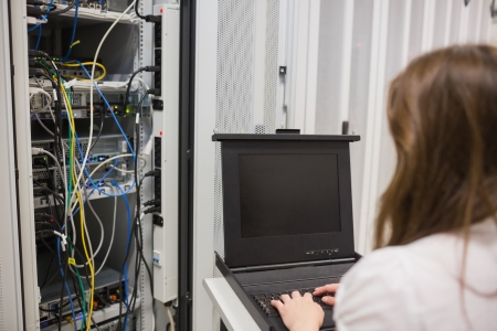 Woman storing data on server in data center