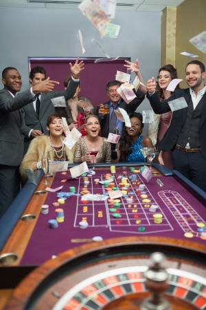 People throwing money at the casinoの写真素材