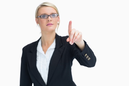 Blonde woman pointing on something in the airの写真素材