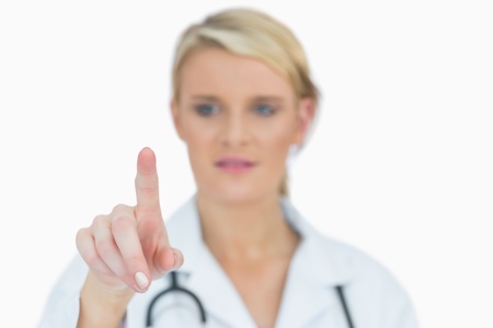 Female doctor pointing aheadの写真素材