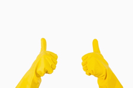 Yellow rubber gloves showing thumbs up 