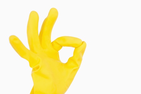 Hand in rubber glove showing ok symbol の写真素材