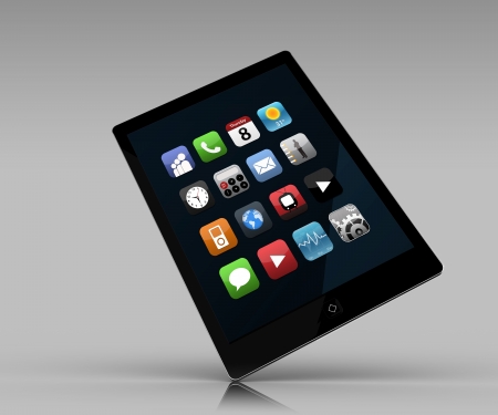 Tablet PC with applications standing against grey backgroundの写真素材