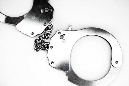 Handcuffs against white backgroundの写真素材