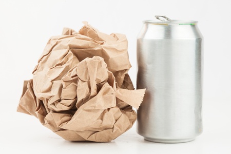 Empty can and crushed paper bag for recyclingの写真素材