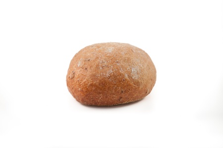 Wholemeal bun lying on white background 