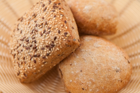Wholemeal bread lying in wicker bowl の写真素材