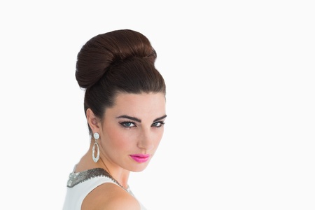 Woman made up in sixtes mod style on white background