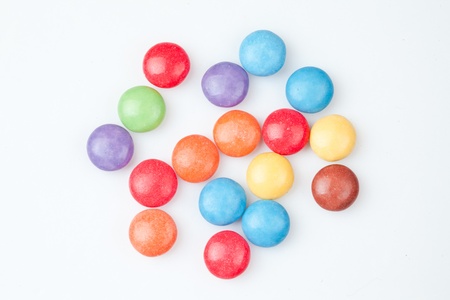 Candies multi coloured against white backgroundの写真素材