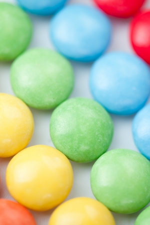 Chocolate sweetmeat multicolored against a white backgroundの写真素材