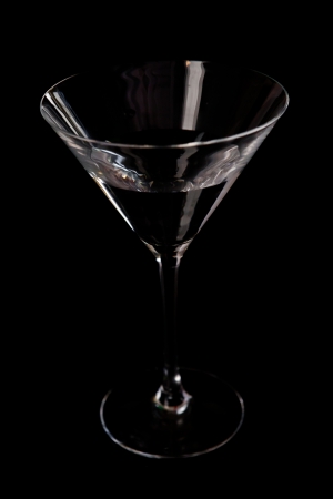 Cocktail glass against a black backgroundの写真素材