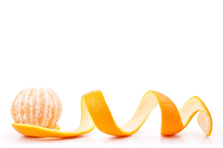 Orange posed on a orange peel against white backgroundの写真素材