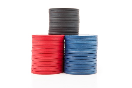 Colourful poker coins against a white backgroundの写真素材
