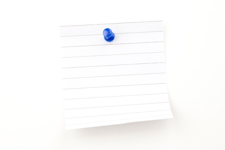 Blank paper with blue pushpin against a white backgroundの写真素材