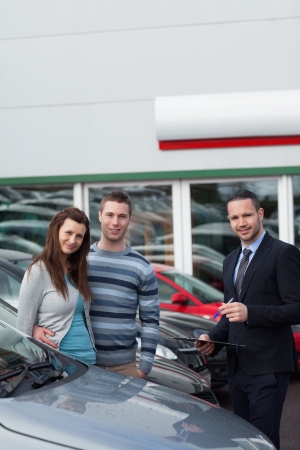 Clients buying a new car in a dealershipの写真素材