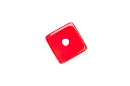 Dice designating a number one against a white background