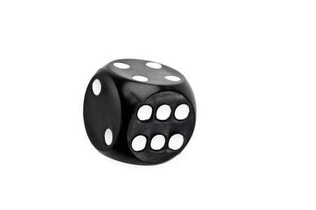 Black dice in motion against a white background