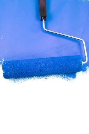 Painting with a blue color on a white wallの写真素材