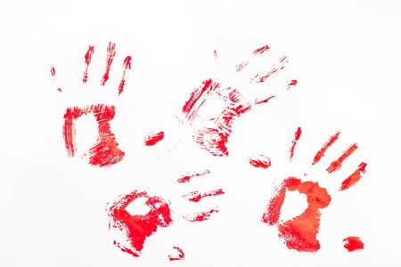 Four red handprints against a white backgroundの写真素材