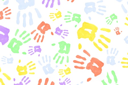 Multi colored handprints against a white backgroundの写真素材