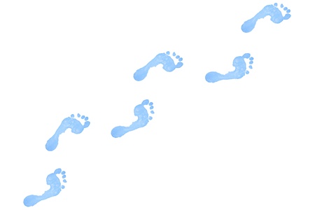 Six blue footprints against a white backgroundの写真素材