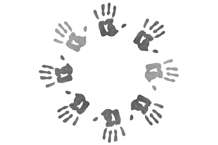 Black handprints forming a circle against a white bcakgroundの写真素材