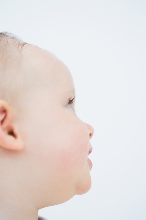Close up of side head of a baby in living roomの写真素材