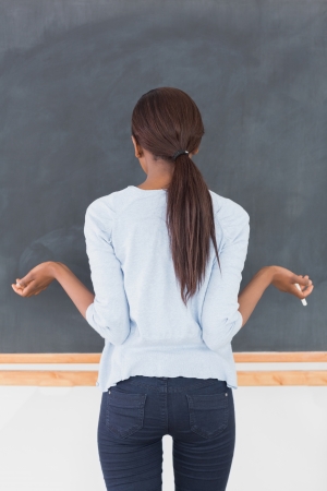 Black woman seeming uncertain in a classroomの写真素材