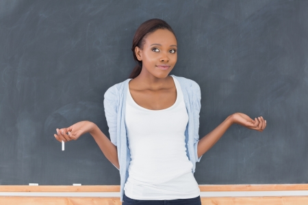 Black woman hesitating in a classroomの写真素材