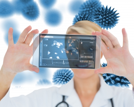 Joyful nurse holding a virtual screen in front of cameraの写真素材