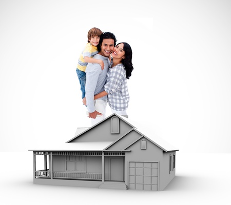 Family standing by graphic house illustrationの写真素材