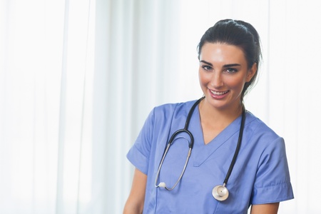 Smiling nurse in blue scrubsの写真素材