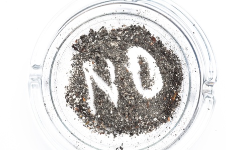 No spelled out in the ash in ashtray on white backgroundの写真素材