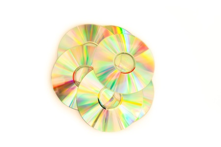 Cd-rom piled up against a white backgroundの写真素材