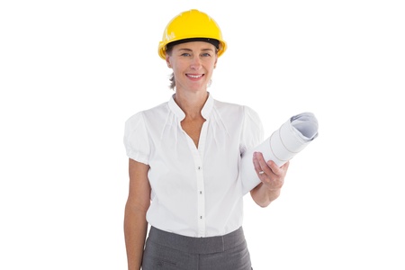Female architect holding plans and hard hat on white background