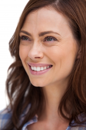 Portrait of a radiant woman on white backgroundの写真素材