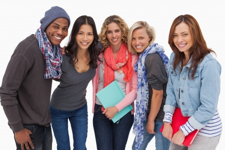 Fashionable students in a row  on white backgroundの写真素材